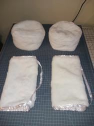 Picture of two cossack style winter caps and hand muffs