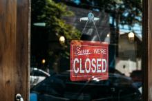 Closed sign in window for August 23 2025