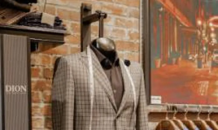 Image of suit jacket on hanging male dress form