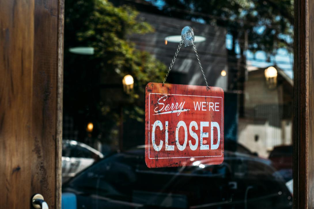 Closed sign in window for August 23 2025